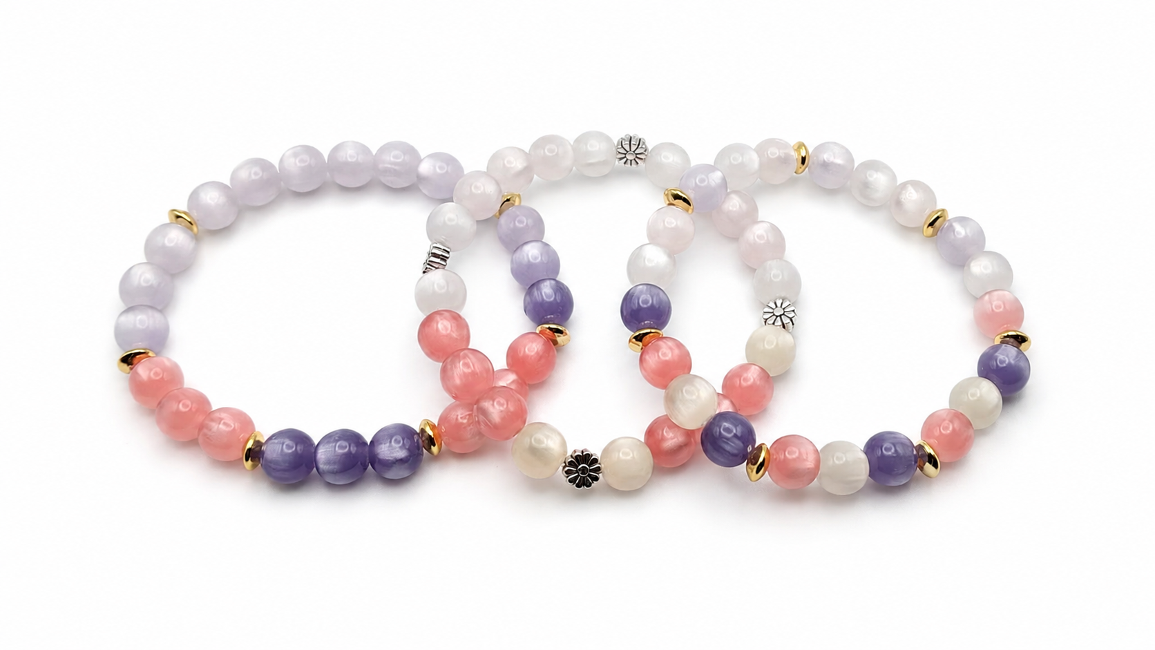 UV color changing bracelet with photochromic cat's eye beads that shift from cream tones indoors to pink and purple shades in sunlight, accented with gold spacer beads and stretch cord