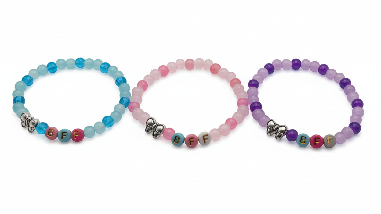 Three-piece BFF friendship bracelet set with 6mm pastel glass beads, colorful letter beads, and metal bow charms designed for matching best friend jewelry and gift bracelet sets for girls
