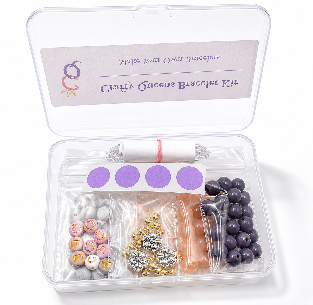 Blush Pop bracelet kit with pink, peach, mauve, and gray glass beads, letter beads, floral charms, and bracelet-making supplies