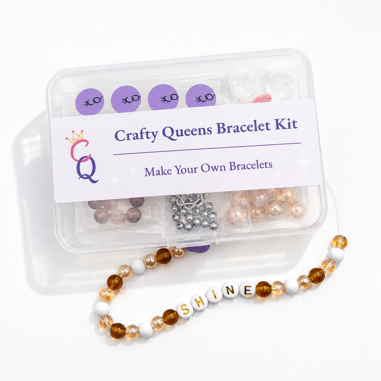 bracelet making kit with champagne gold beads and white beads, finished bracelet design shown in front of kit