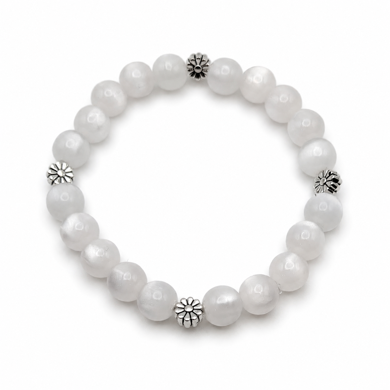 UV color changing bracelet with photochromic cat’s eye beads under room light, appearing cream-white before sunlight exposure, featuring daisy-inspired metal spacers and stretch cord