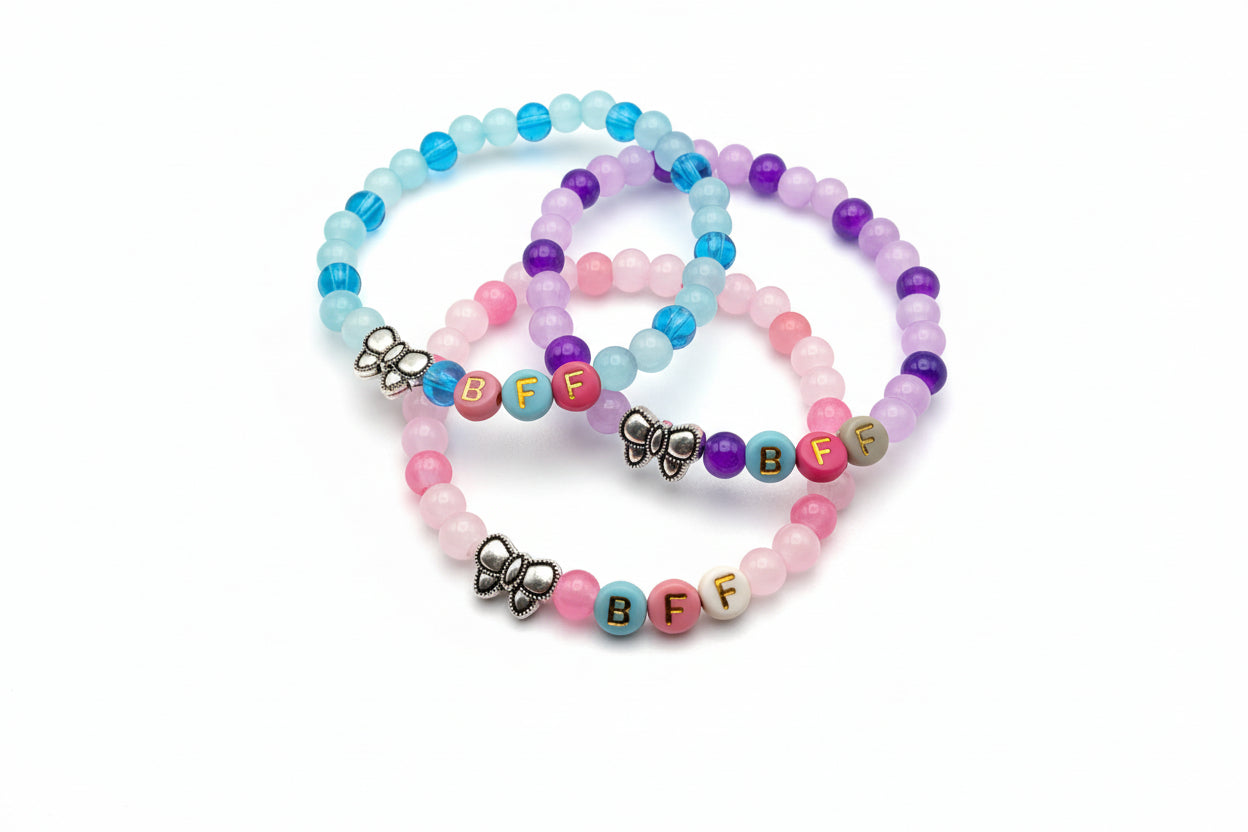 Three-piece BFF friendship bracelet set with 6mm pastel glass beads, colorful letter beads, and metal bow charms designed for girls and friendship gift sharing