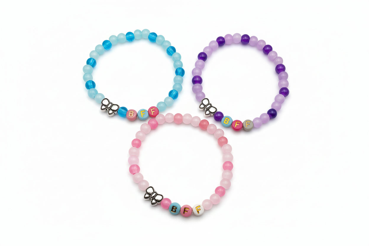 Three-piece BFF friendship bracelet set with 6mm pastel glass beads, colorful letter beads, and metal bow charms designed for girls and friendship gift sharing