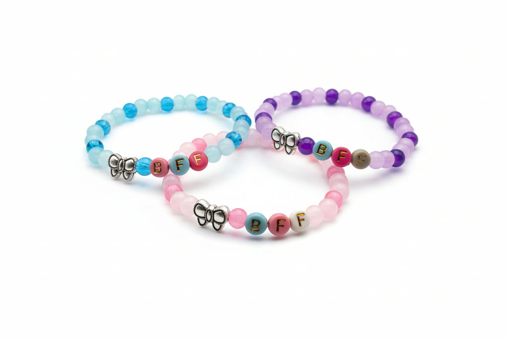 Three-piece BFF friendship bracelet set with 6mm pastel glass beads, colorful letter beads, and metal bow charms designed for girls and friendship gift sharing