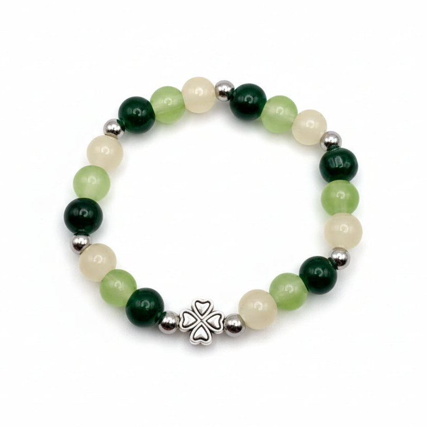 8mm green and ivory glass beaded bracelet with silver spacers and four-leaf clover charm handmade by Crafty Queens