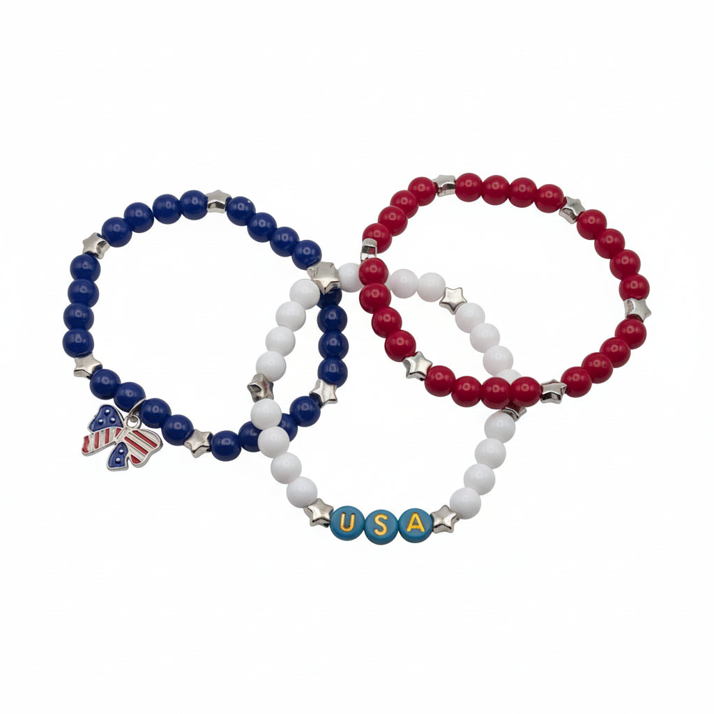 Three-piece patriotic bracelet set with red, white, and blue 6mm glass beads, star accents, USA letter beads, and an American flag bow charm arranged together