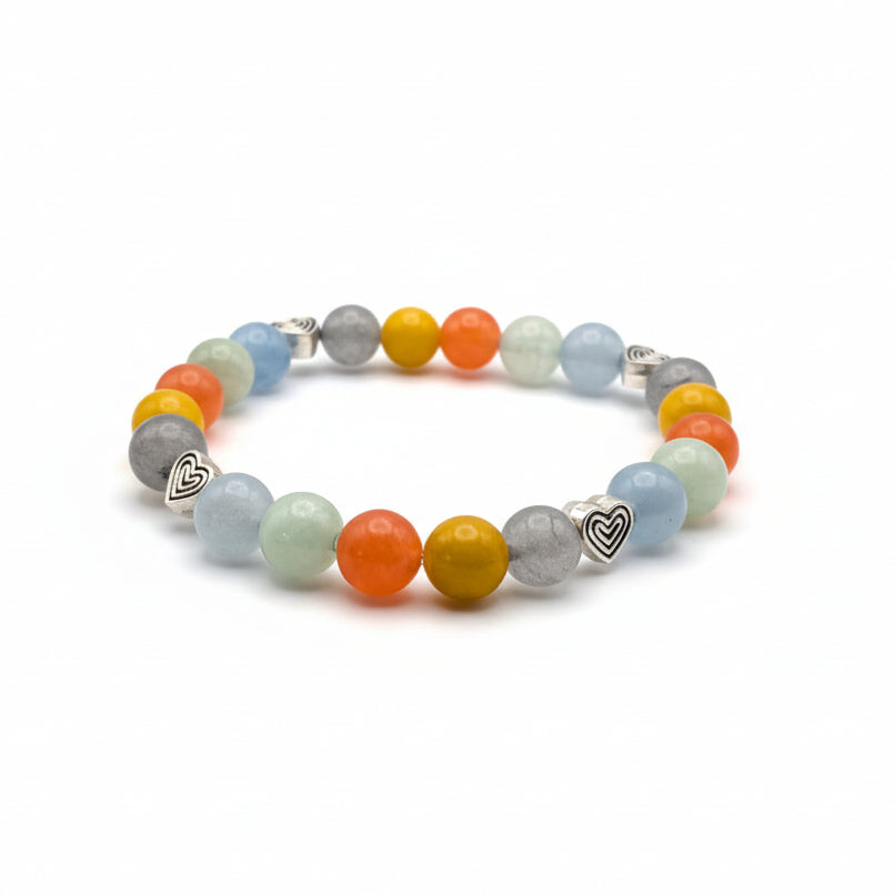 Handmade 8mm natural gemstone beaded bracelet with gray chalcedony, jasper-inspired yellow and orange hues, green and blue tones, and heart-shaped metal spacers