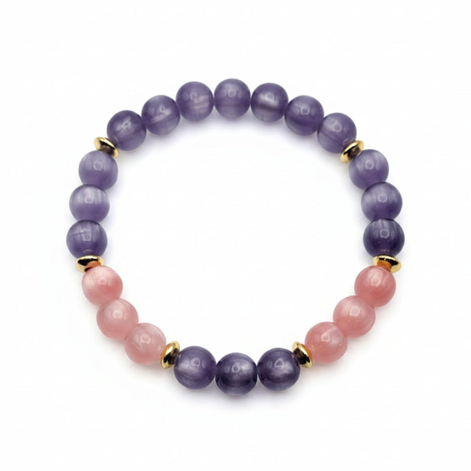 UV color changing bracelet with photochromic cat’s eye beads transformed into berry pink and lavender hues in sunlight, featuring gold spacer beads
