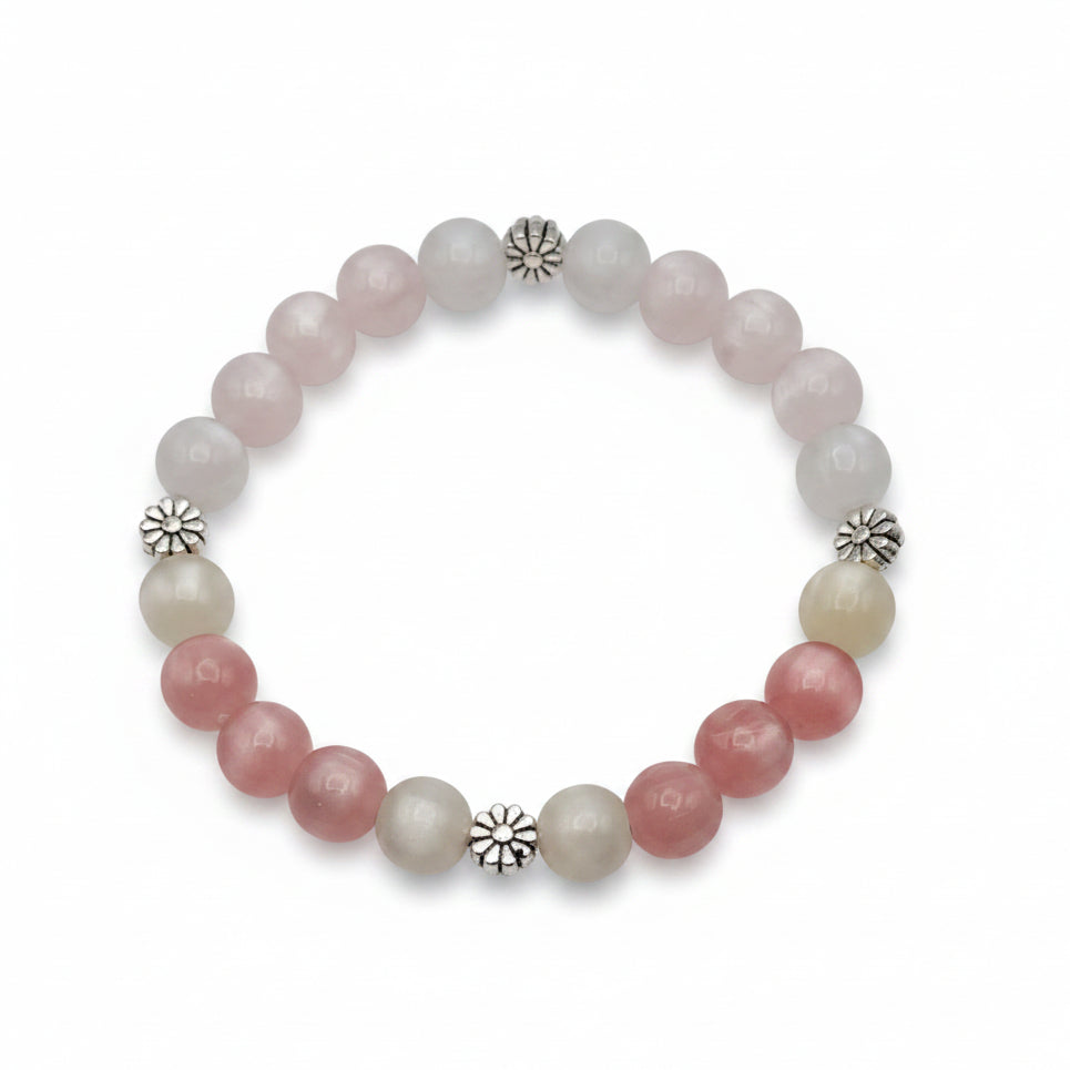 UV color changing bracelet with photochromic cat’s eye beads that transform from cream tones to blush pink and yellow hues in sunlight, featuring daisy-inspired metal spacers and stretch cord