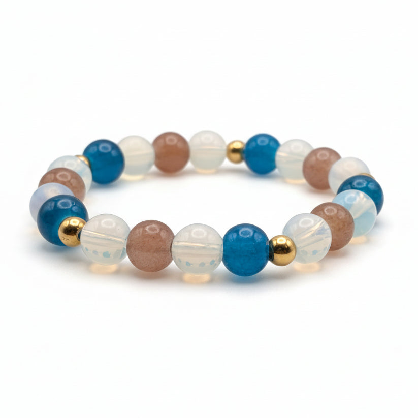 Coral Coast 8mm glass bead stretch bracelet with blue, coral and opalescent beads and golden stainless steel spacers